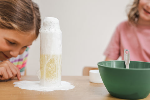 Children play with a Christmas sensory bottle activity.