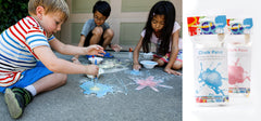 Kids playing with the fizzing chalk kit for July 4th