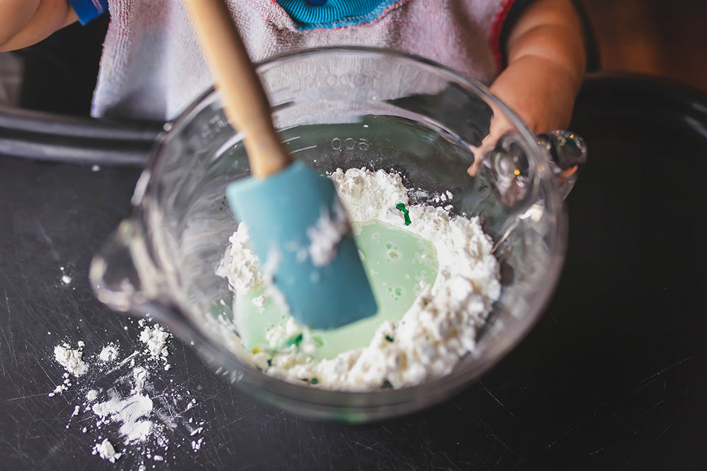 oobleck ingredients in a glass mixing bowl