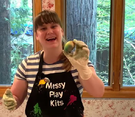 Robin holding her finished Marble Dyed Easter Egg