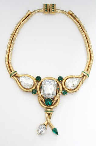 gold necklace with large green stones