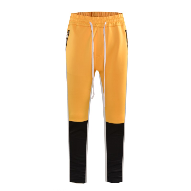 yellow track pants with white stripe