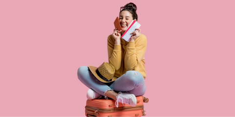 Girl Holding A Passport and Ticket Sitting in a Suitcase
