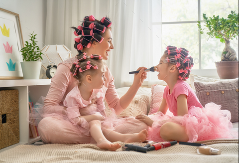 Mom doing makeup with her kids