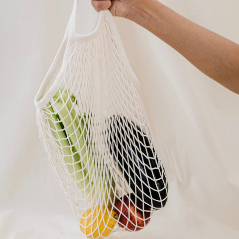 Grocery bag full of produce.