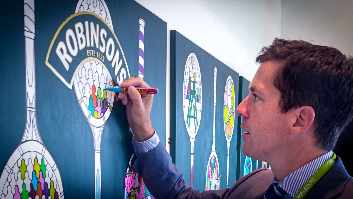 tim henman contributing to a colouring wall