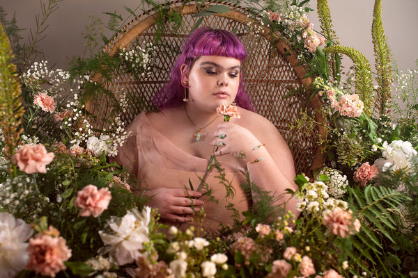 self love with cydni akbar, wearing eathical jewellery and speaking with forage design on a botanical set 