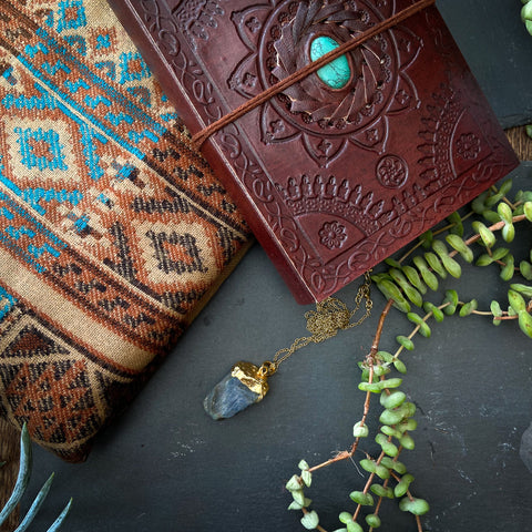 boho christmas gift set with raw stone gold dipped labradorite pendant, leather bound book with turquoise gemstone and bohemian blanket scarf with aztec print 