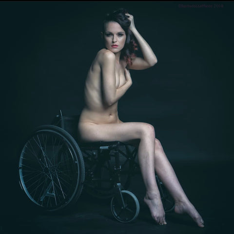 Little Peaches is posing nude in her wheelchair with her hair tumbling around her shoulders | Forage Design | Ethical Brads UK | Fair Trade Clothing | Bohemian Clothes | Boho Jewellery
