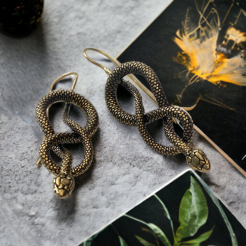 Snake Earrings | Snake jewelry significance, Mystical serpent symbolism, Serpent motifs in history, Wearing snake-inspired jewelry, Spiritual meaning of snake jewelry, Serpent symbolism in fashion, Serpent as a symbol of protection, Serpent jewelry and transformation, Serpent mystique in paganism,
