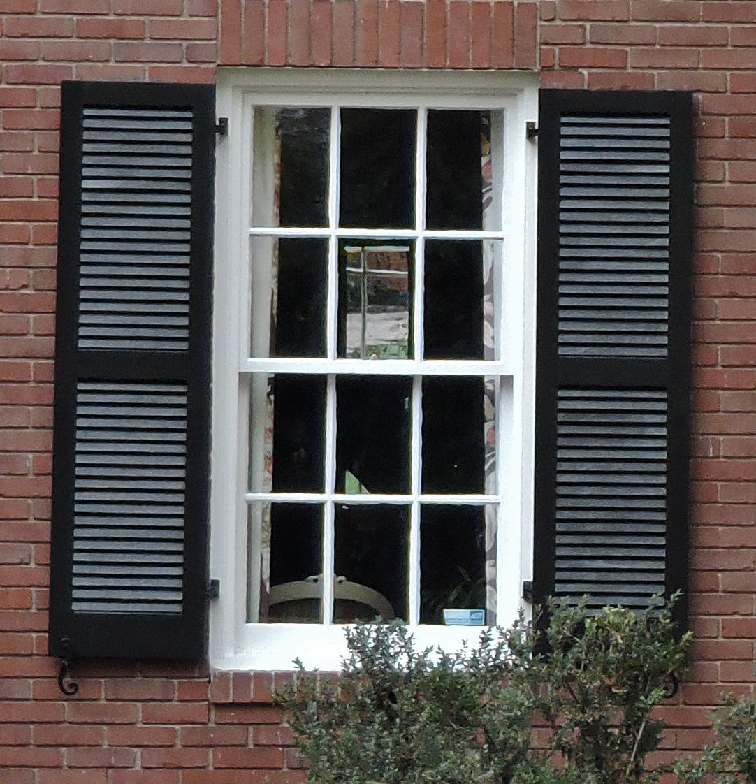black louvered exterior window shutters on a brick house for brockwell incorporated's illustrated glossary of classical architectural terms