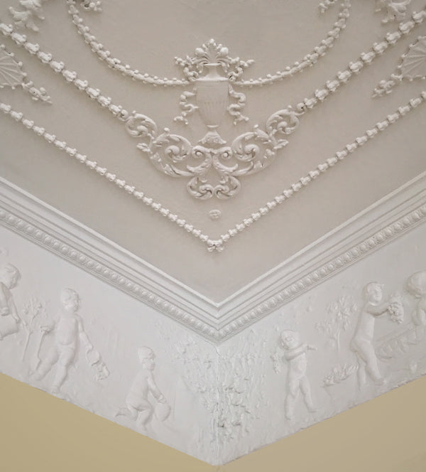 decorative plaster molding on a yellow-painted wall - brockwell incporated