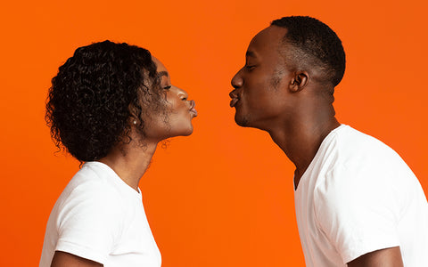 Couple about to kiss – so romantic unless one loves peanuts and the other is allergic to them. Traces can linger in saliva