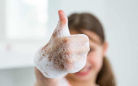 For people with food allergies washing hands with soap and water is a must before eating. This little girl loves the bubbles.