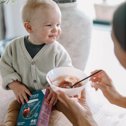 dairy-free baby eating a dairy-free fruit puree