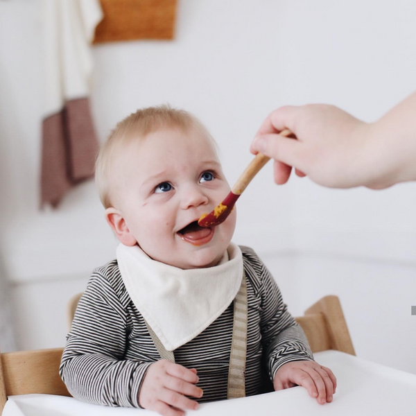 A Guide To Feeding Baby Solids: When, What & How Much