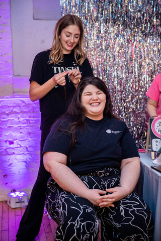 A woman receiving hair treatment