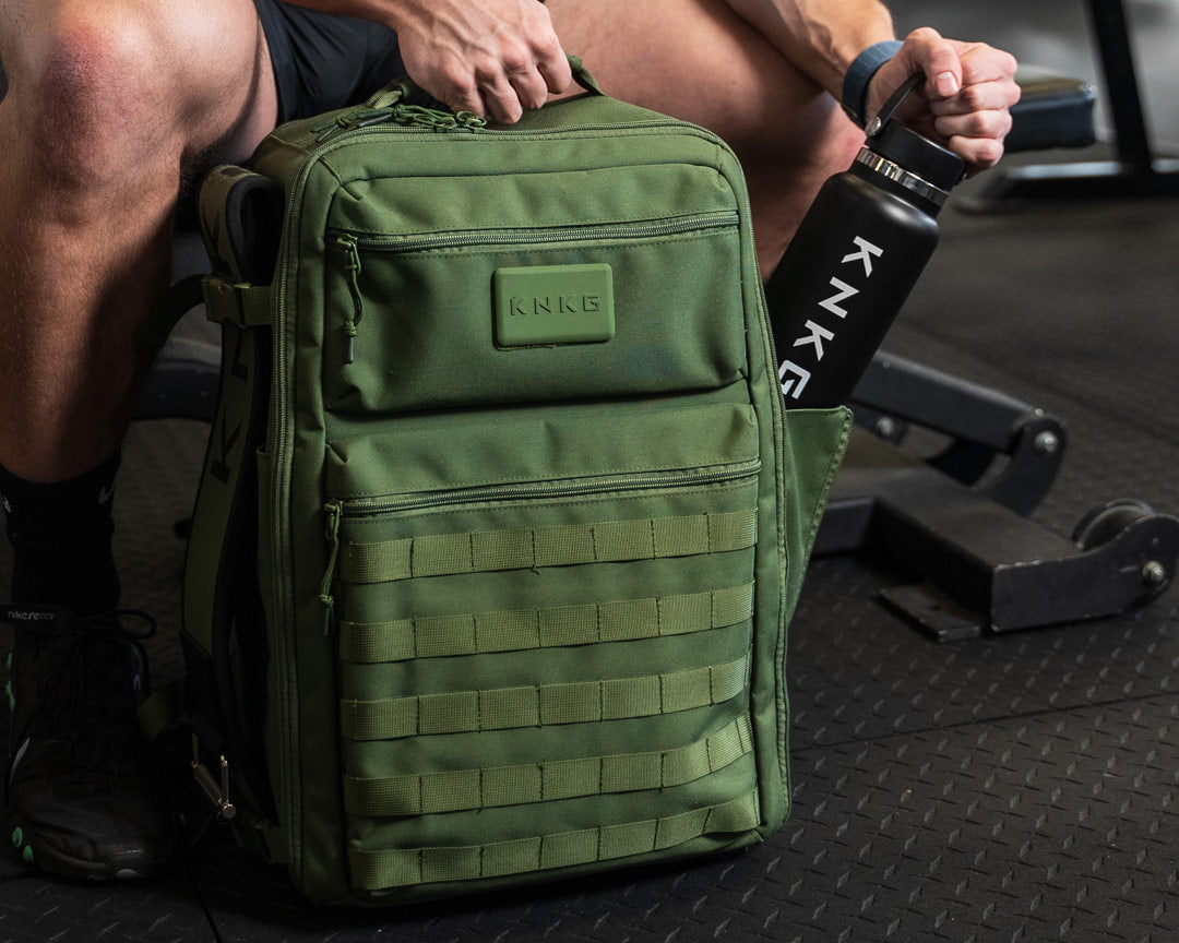 Bottle pockets on green tactical backpack