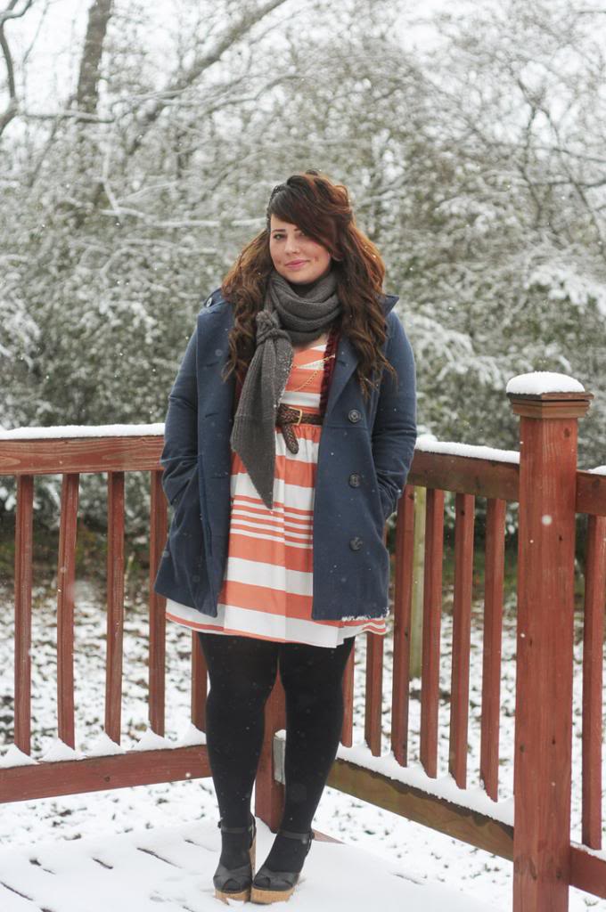 Kaelah keeping warm with a grey scarf on a snowy day