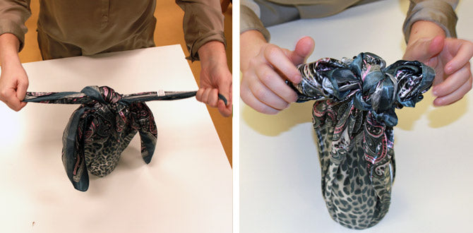 Securing the bottle by tying the other 2 corners at the bottle's bore with a square animal print scarf