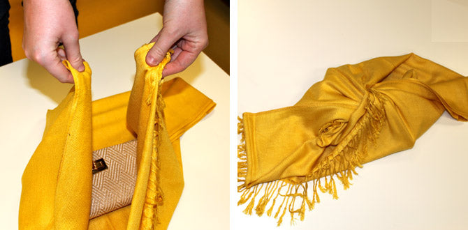 Tying the first 2 corners in a knot at the midpoint to wrap the wallet with a rectangular yellow scarf