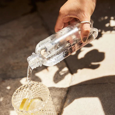 mountain falls water bottle being poured into a cup