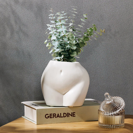 https://cdn.shopify.com/s/files/1/2553/1740/products/jofamy-butt-ceramic-plant-pot-woman-body-shaped-flower-pot-with-drainage-hole_512x512.jpg?v=1671263252