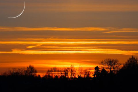 Sunset with crescent moon