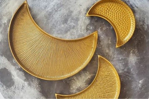 RASM's textured, crescent shaped serving platters in three different sizes (sm, med & lg) in gold color