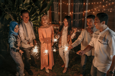 Muslim celebrating Eid holidays with fireworks and sparklers