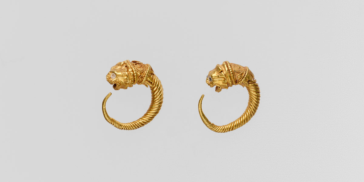 Intricate gold lion earrings from ancient greece ca. 300 BCE