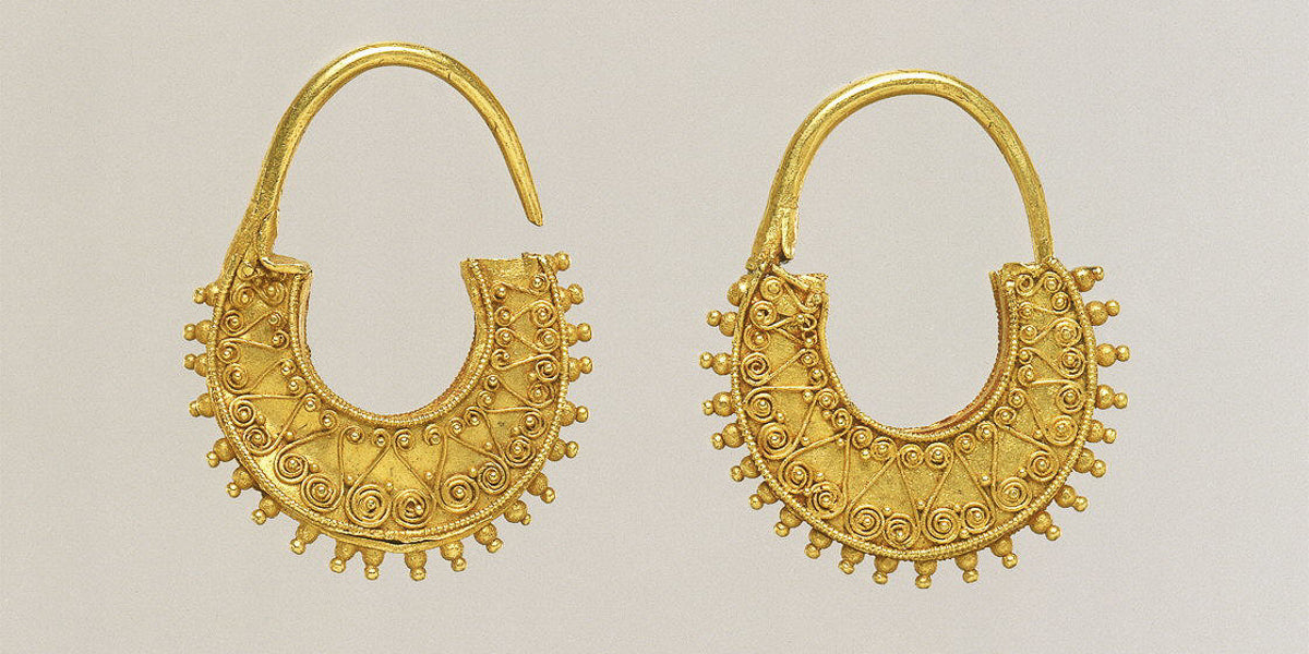 Gold crescent-shaped earrings from ancient greece