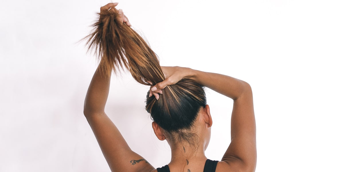 Woman putting her hair up