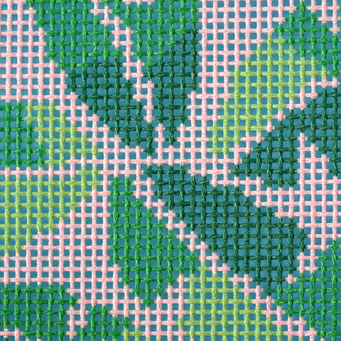 Close up of pink palm leaf needlepoint canvas