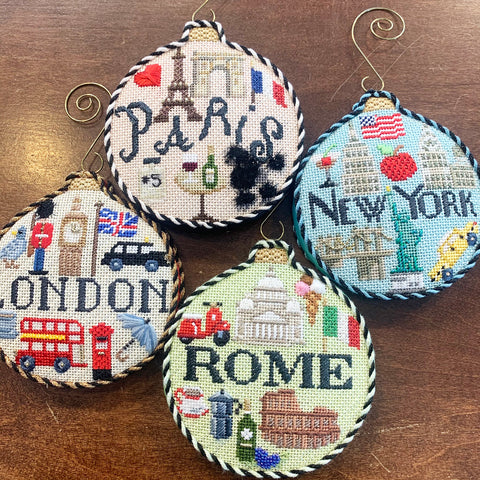 4 travel round finished needlepoint ornaments