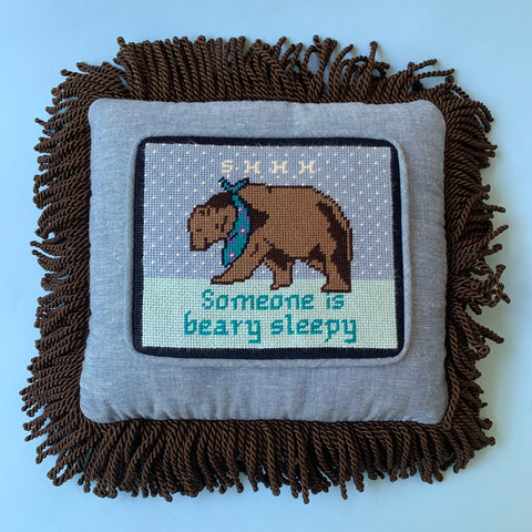 Finished Beary Sleepy needlepoint pillow with fringe