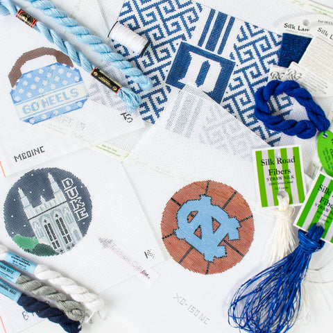 Duke & UNC needlepoint canvases with threads