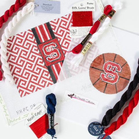 NC State needlepoint canvases with threads