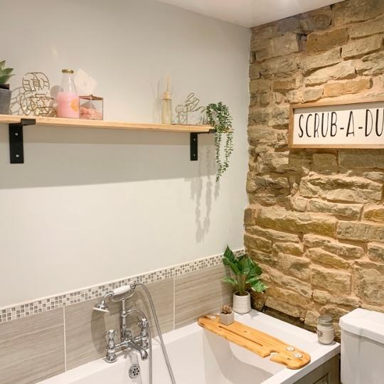 floating shelf above bath for extra storage