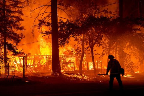 Firefighter in front of California wildfire, 2021