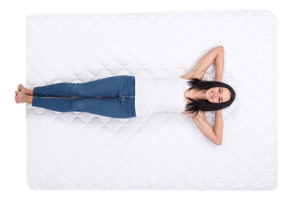 girl laying on hybrid mattress Dynasty