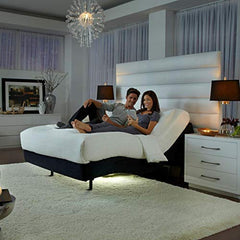 Couple Using Remote Control While Laying on Adjustable Mattress | Dynasty Mattress