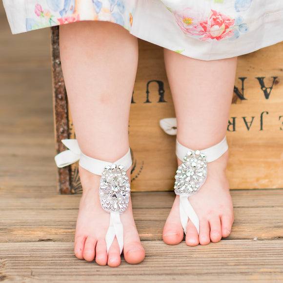 little girl barefoot sandals