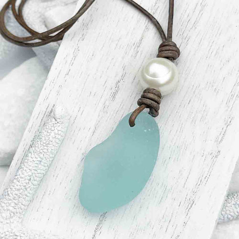 Solid Bottle Bottom Aqua Sea Glass Paired with a Bright Ivory Pearl on a Leather Necklace