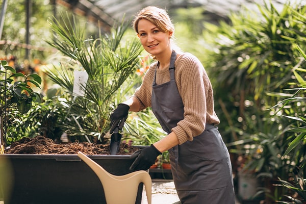 woman holding small shovel