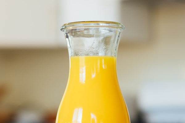 Orange juice in a glass bottle