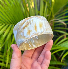 Person holding water buffalo bangle