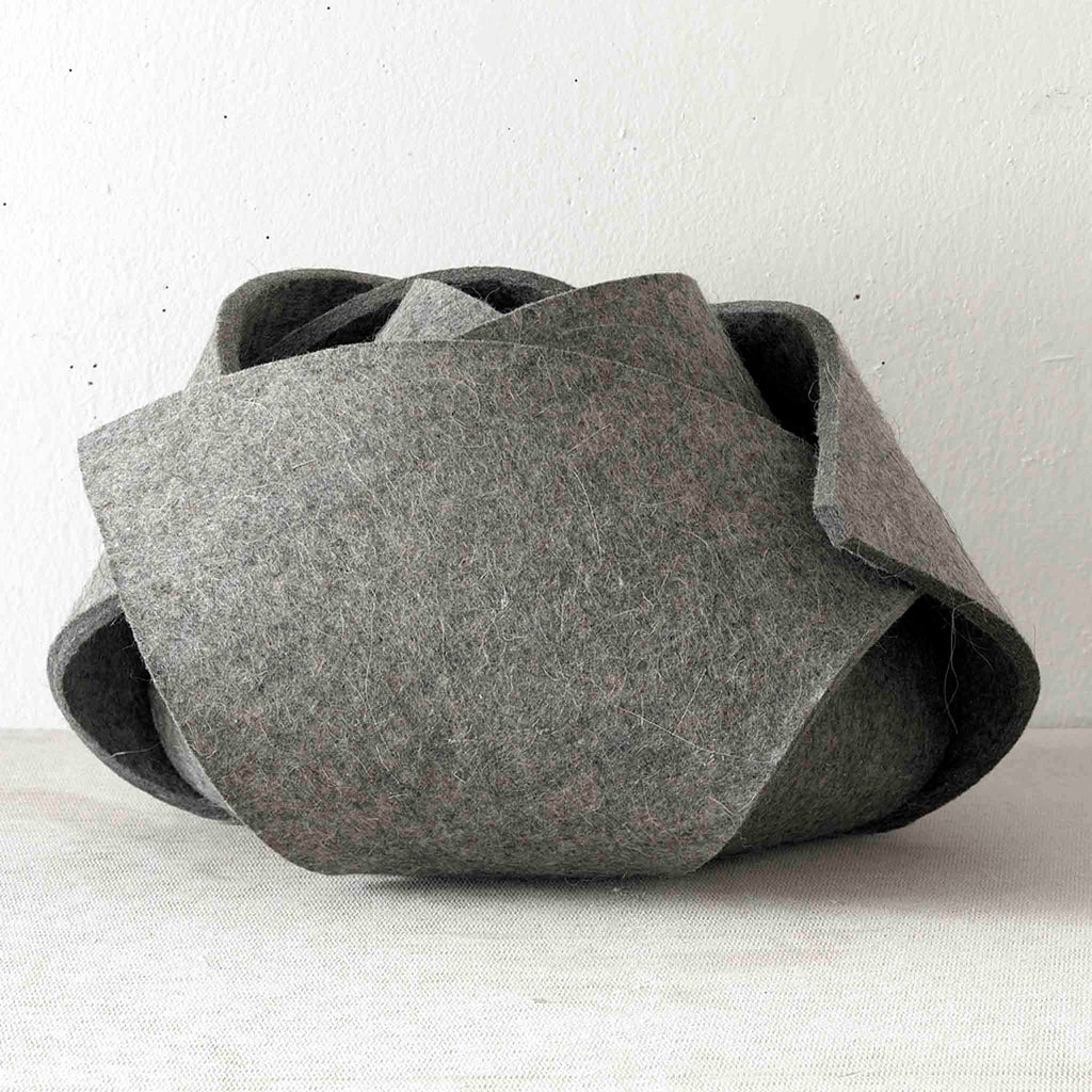 Rosebud Felt Bowl by Domestic Aesthetic. This single piece of industrial felt transforms into any number of shapes with the help of magnetic connections but we prefer it as a lovely rosebud. 