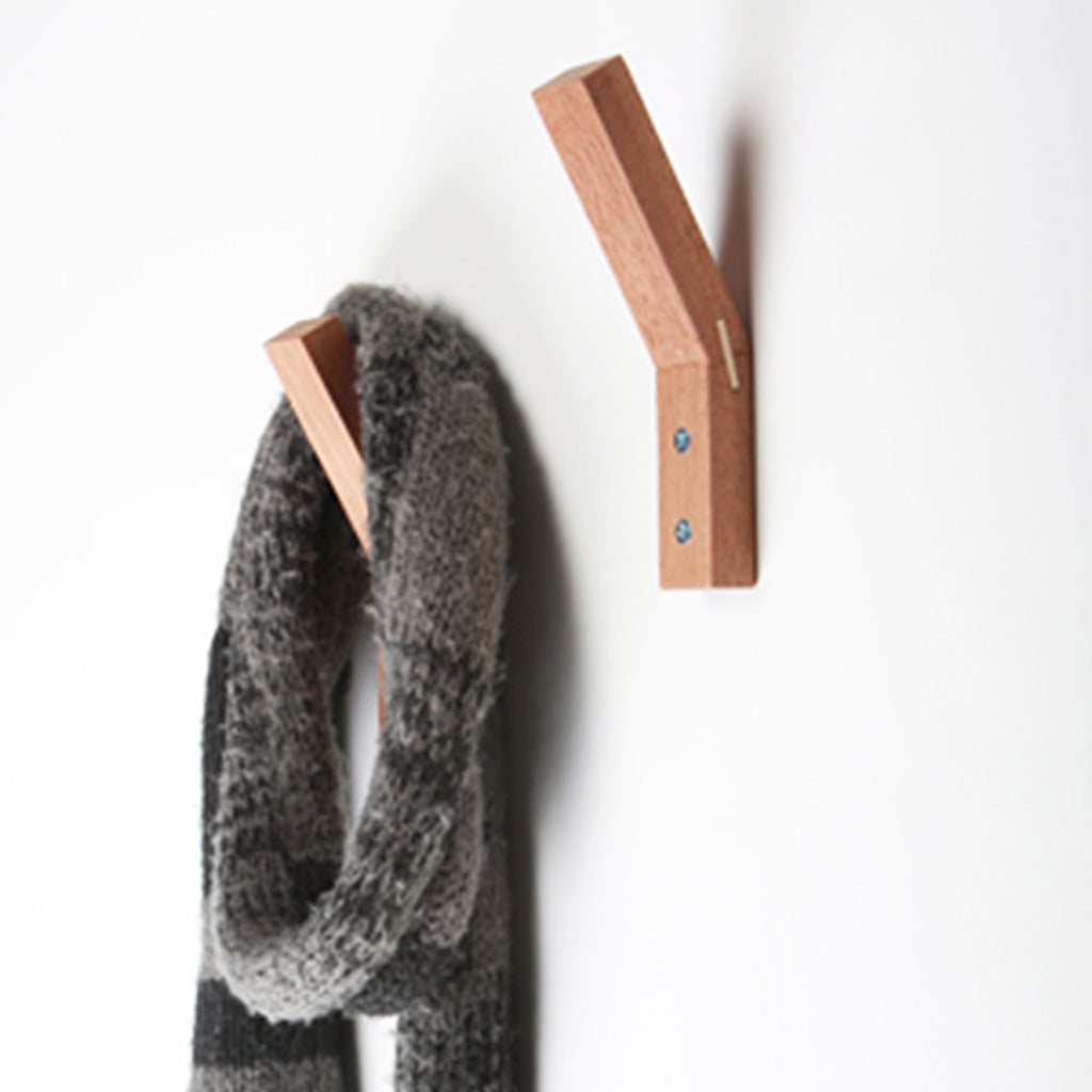 Hang Out Hooks by DavidZachary. Handmade in Brooklyn, these coat hooks are made from reclaimed, post-manufacturing off-cut wood. Sold in sets of two hooks.