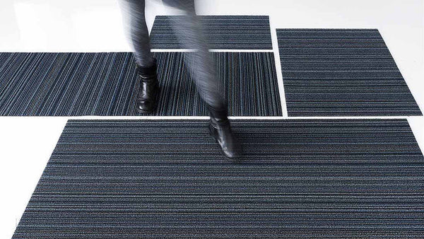 Tufted, trusted, and tough. A Chilewich signature, this easy-care floor mat combines a graphic pattern and inviting texture with enduring performance, indoors or out.